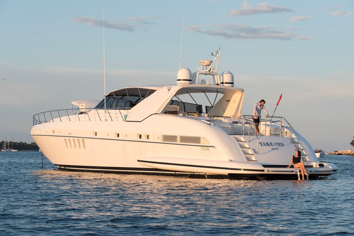 a white yacht in the water aboard TAKE OFF Yacht for Sale