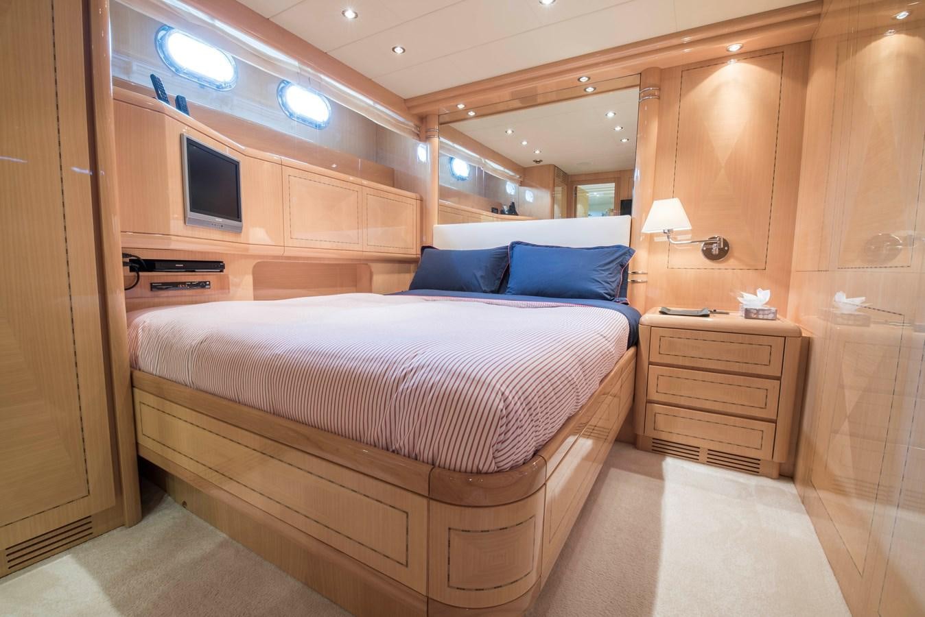 a room with a bed and a television aboard TAKE OFF Yacht for Sale