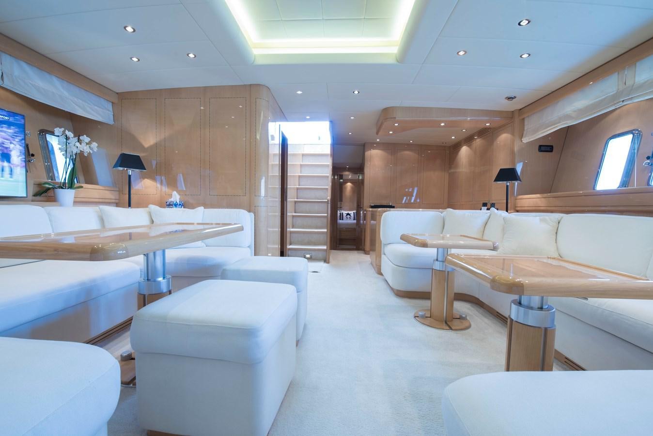 a room with a couch and a table aboard TAKE OFF Yacht for Sale