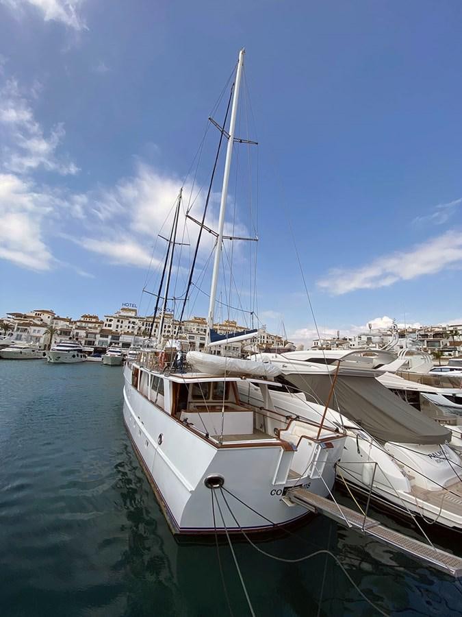 a boat docked at a pier aboard COLUMBUS OF LYMINGTON Yacht for Sale
