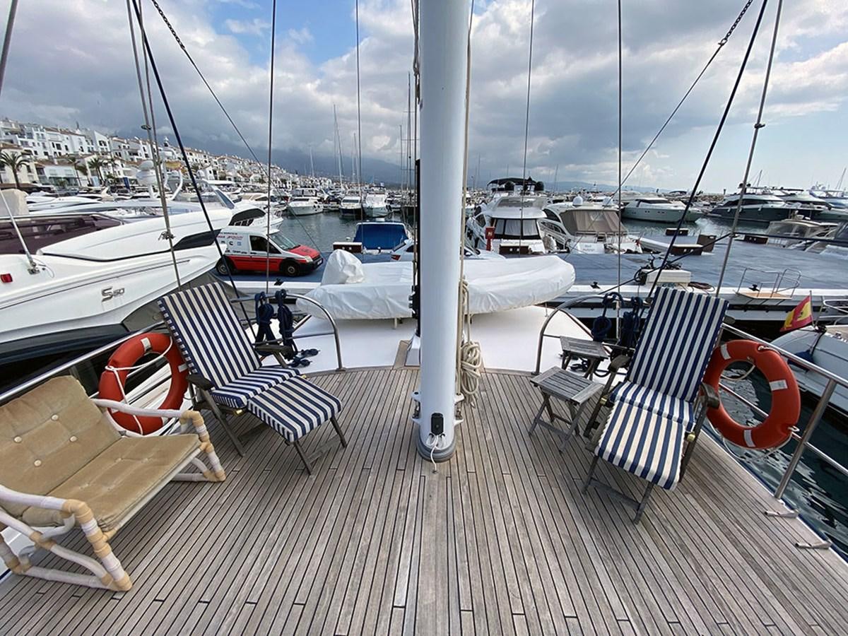 a deck with boats and chairs aboard COLUMBUS OF LYMINGTON Yacht for Sale