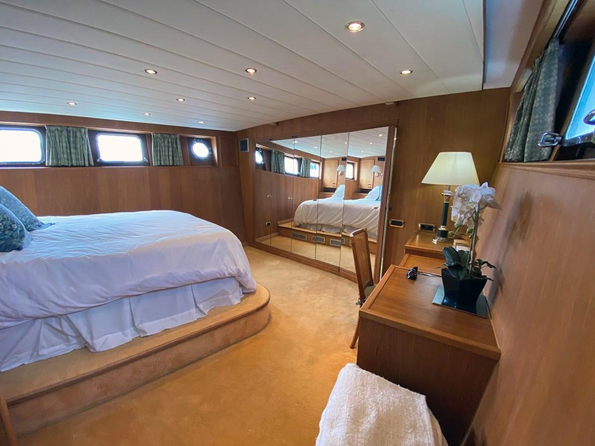 a room with a bed and a television aboard COLUMBUS OF LYMINGTON Yacht for Sale