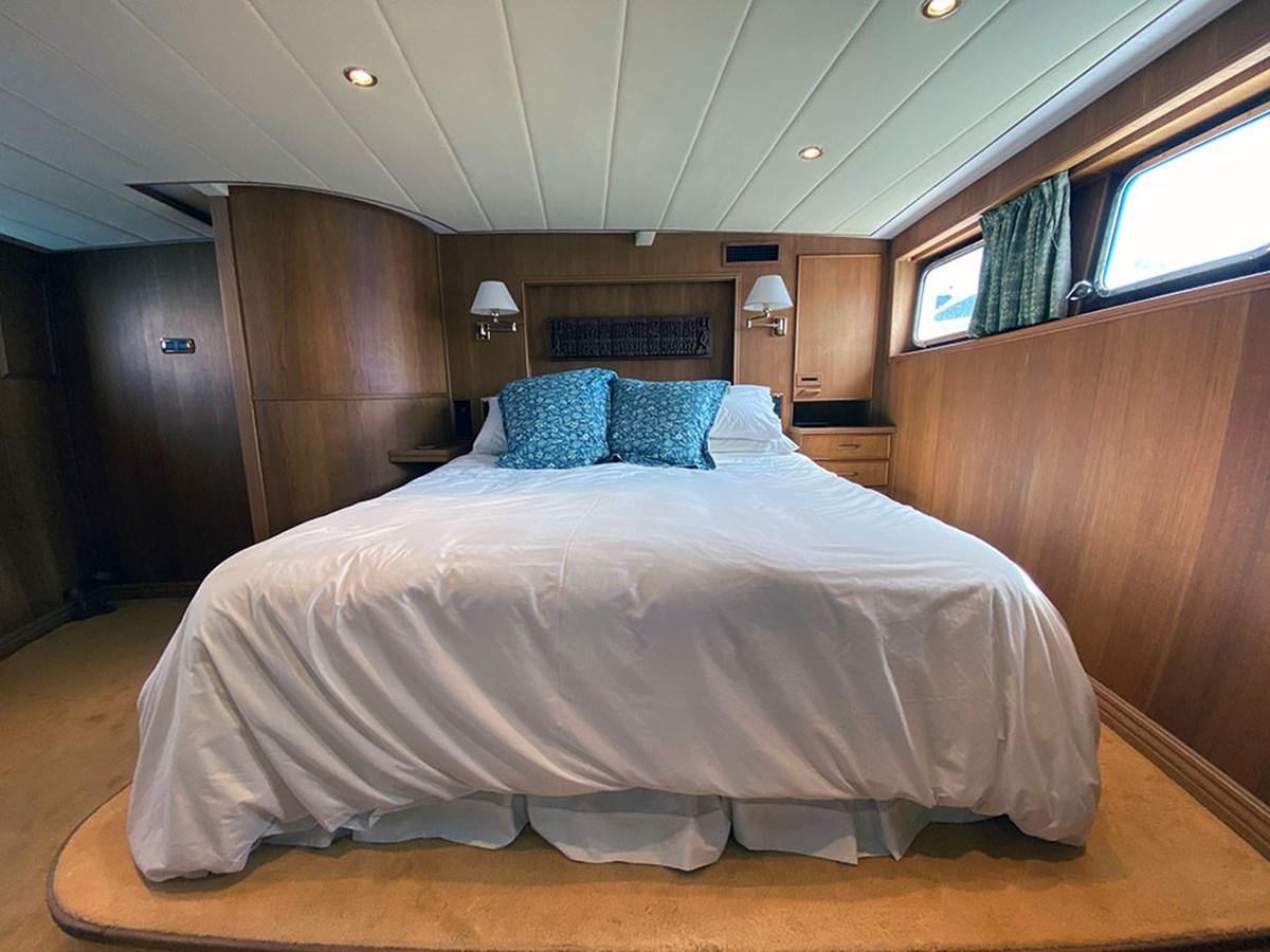 a large bed in a room aboard COLUMBUS OF LYMINGTON Yacht for Sale