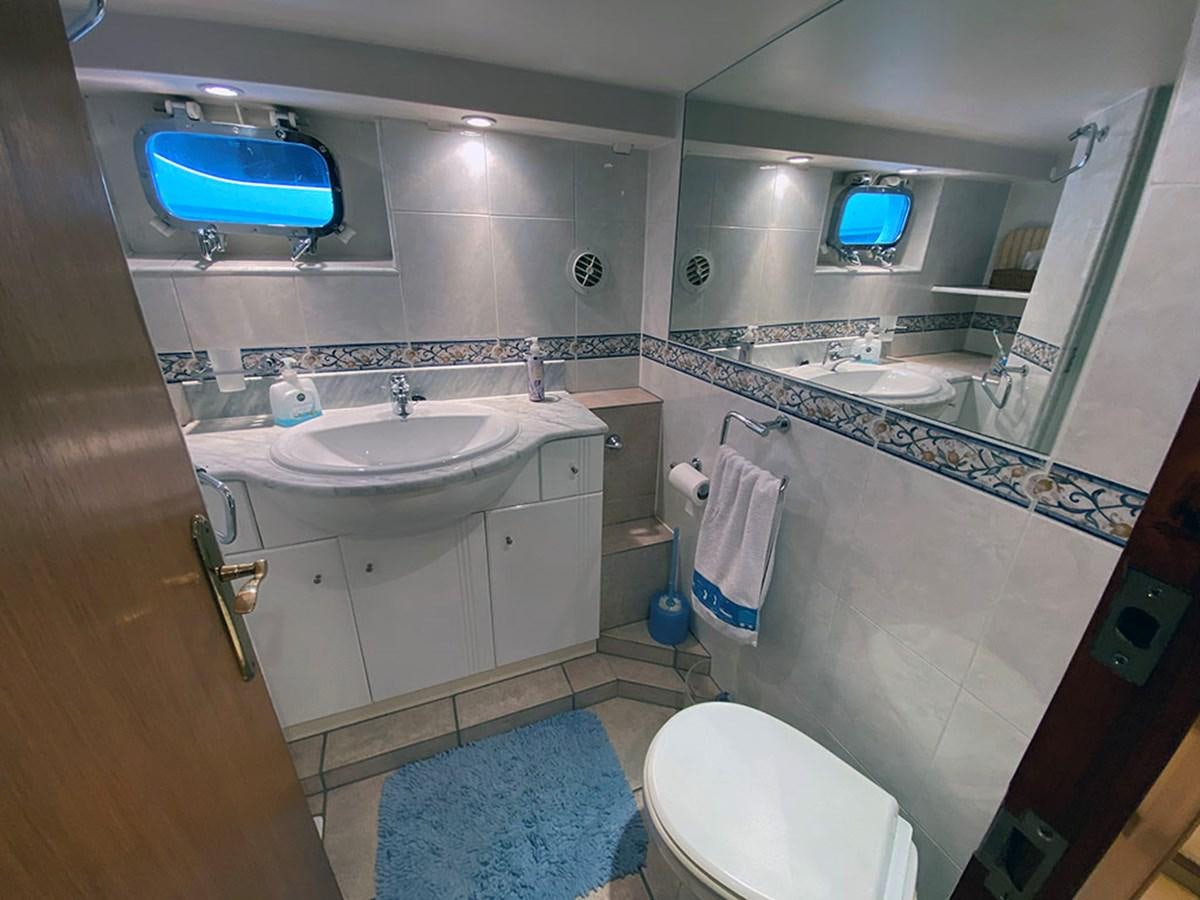 a bathroom with a sink and a toilet aboard COLUMBUS OF LYMINGTON Yacht for Sale