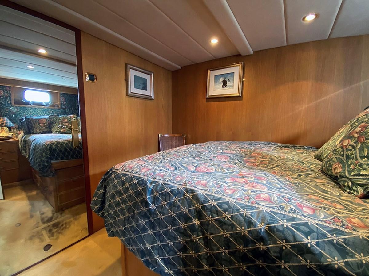 a bedroom with a bed aboard COLUMBUS OF LYMINGTON Yacht for Sale