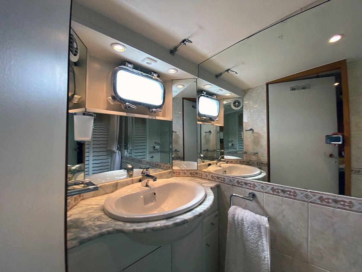 a bathroom with a large mirror aboard COLUMBUS OF LYMINGTON Yacht for Sale