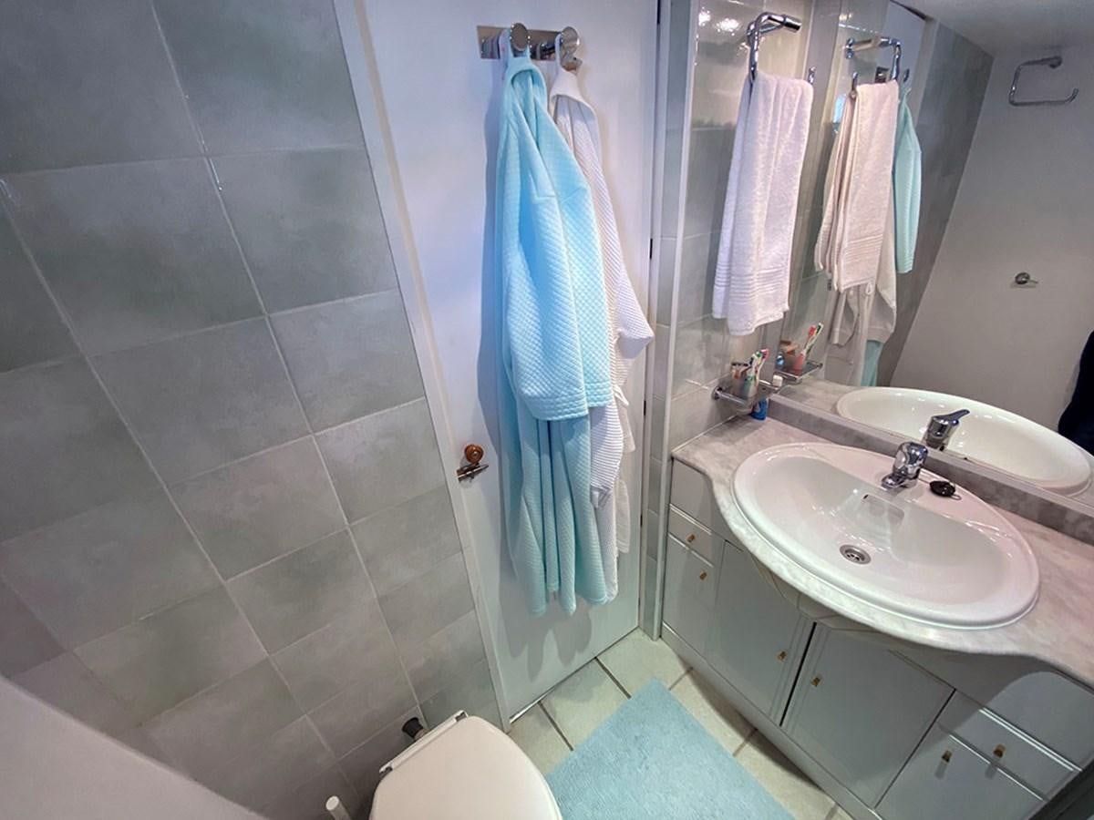 a bathroom with a sink and a toilet aboard COLUMBUS OF LYMINGTON Yacht for Sale
