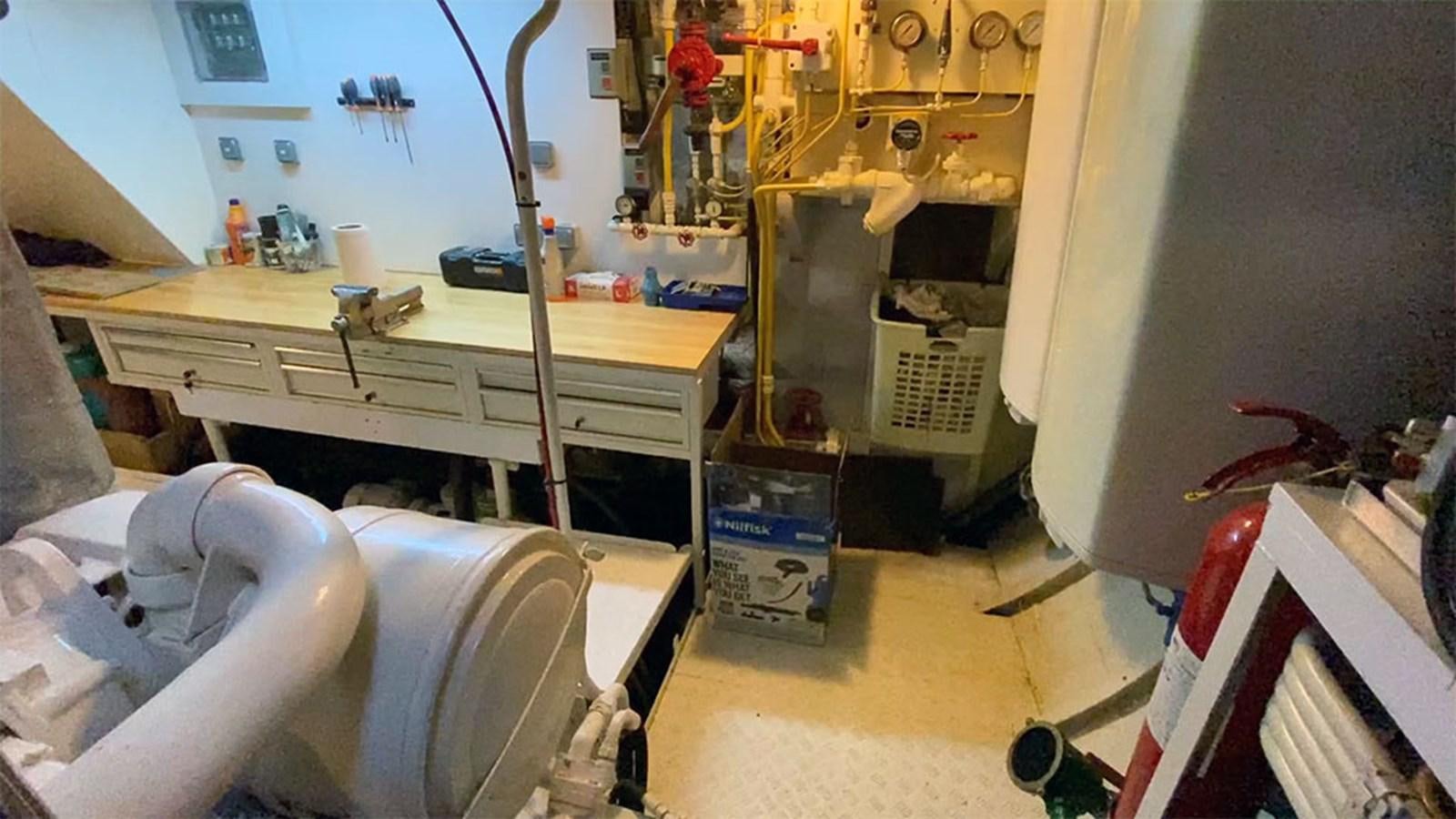 a room with a desk and a chair aboard COLUMBUS OF LYMINGTON Yacht for Sale