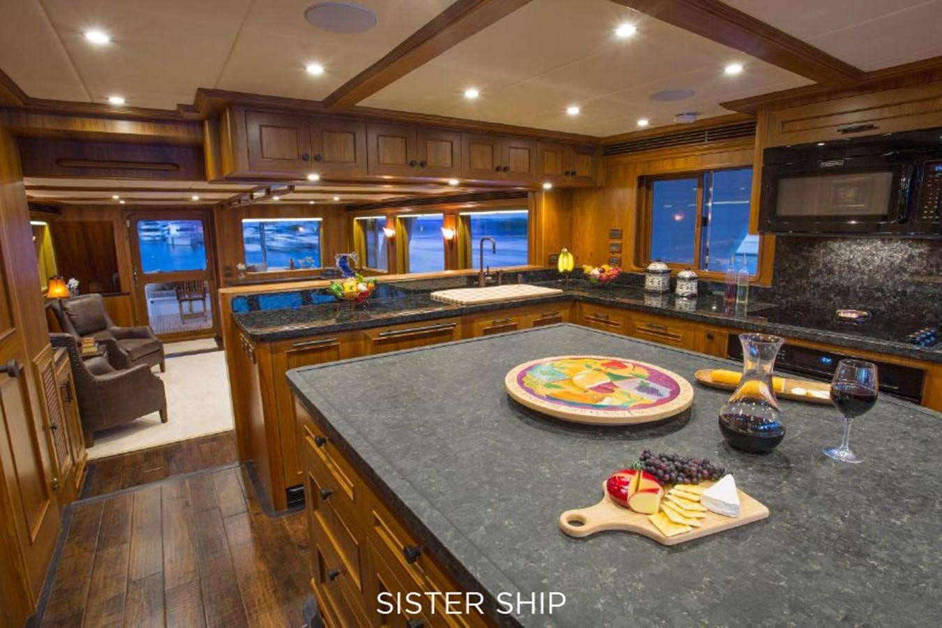 a kitchen with a large island aboard 820 CPMY Yacht for Sale