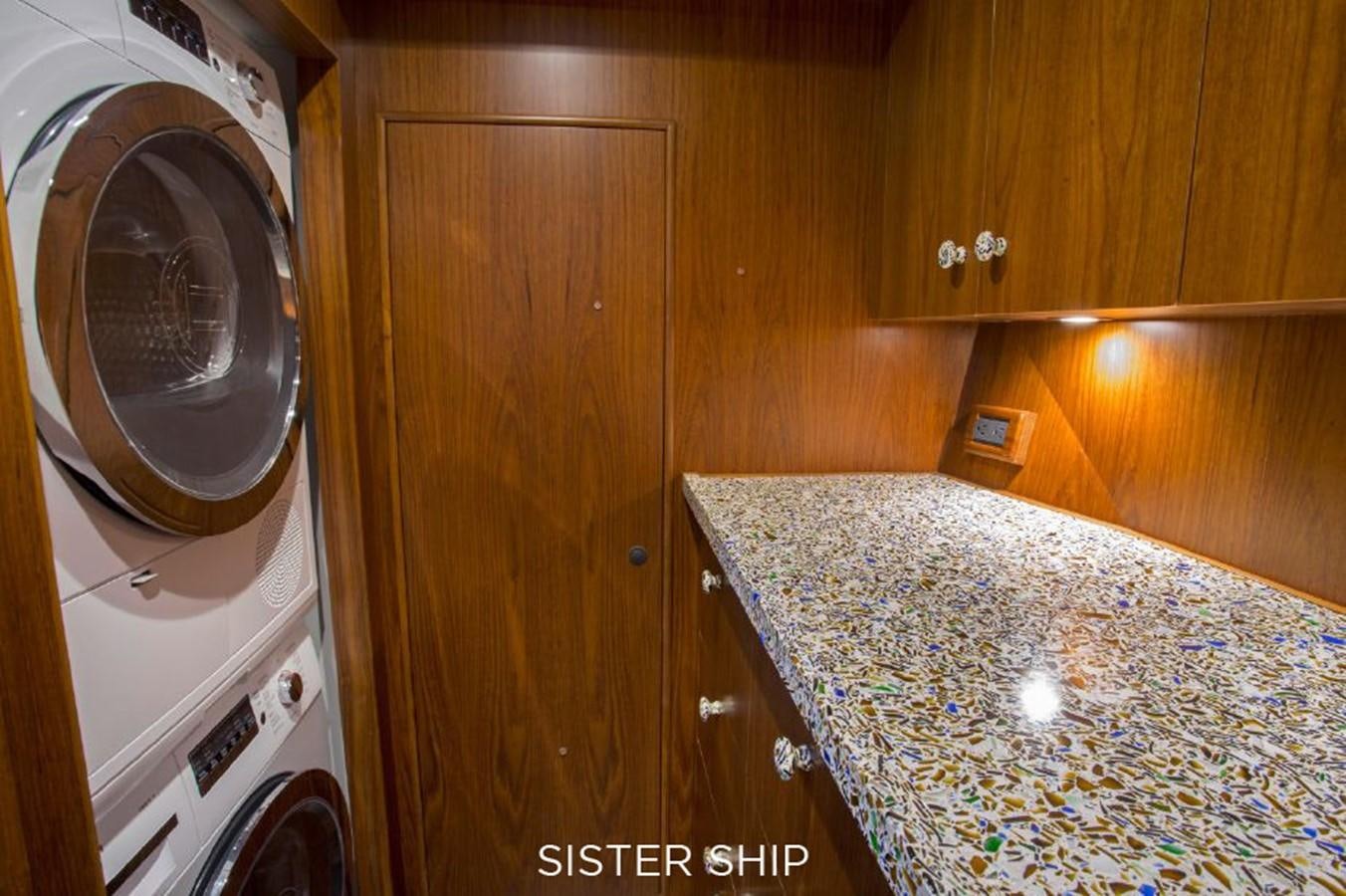a washing machine in a kitchen aboard 820 CPMY Yacht for Sale