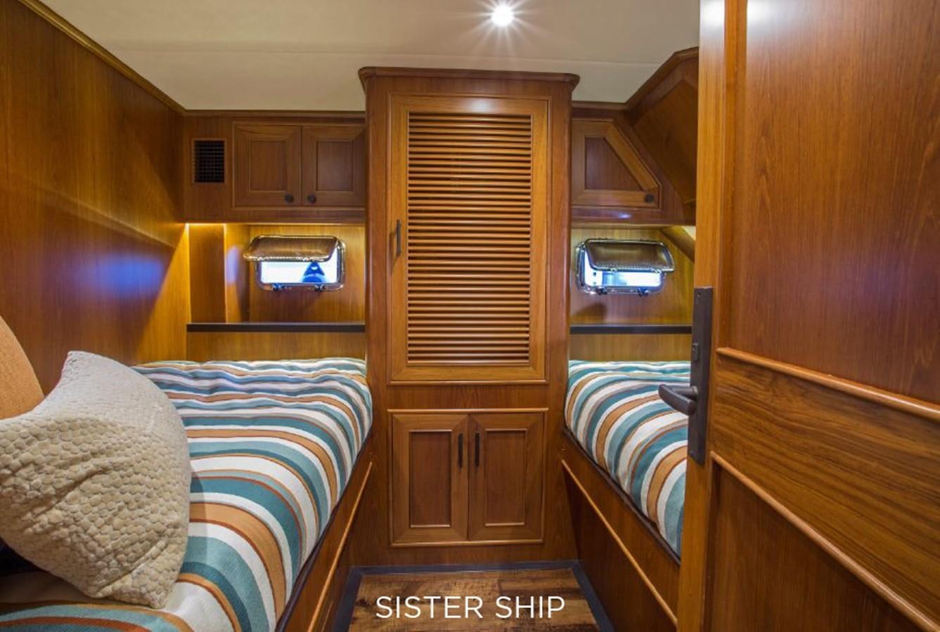 a room with a bed and a television aboard 820 CPMY Yacht for Sale