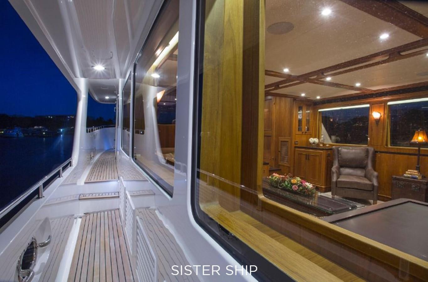 a room with a view of the water and a balcony aboard 820 CPMY Yacht for Sale