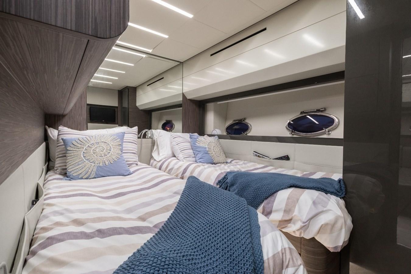 a person lying on a bed aboard SIPSEY Yacht for Sale