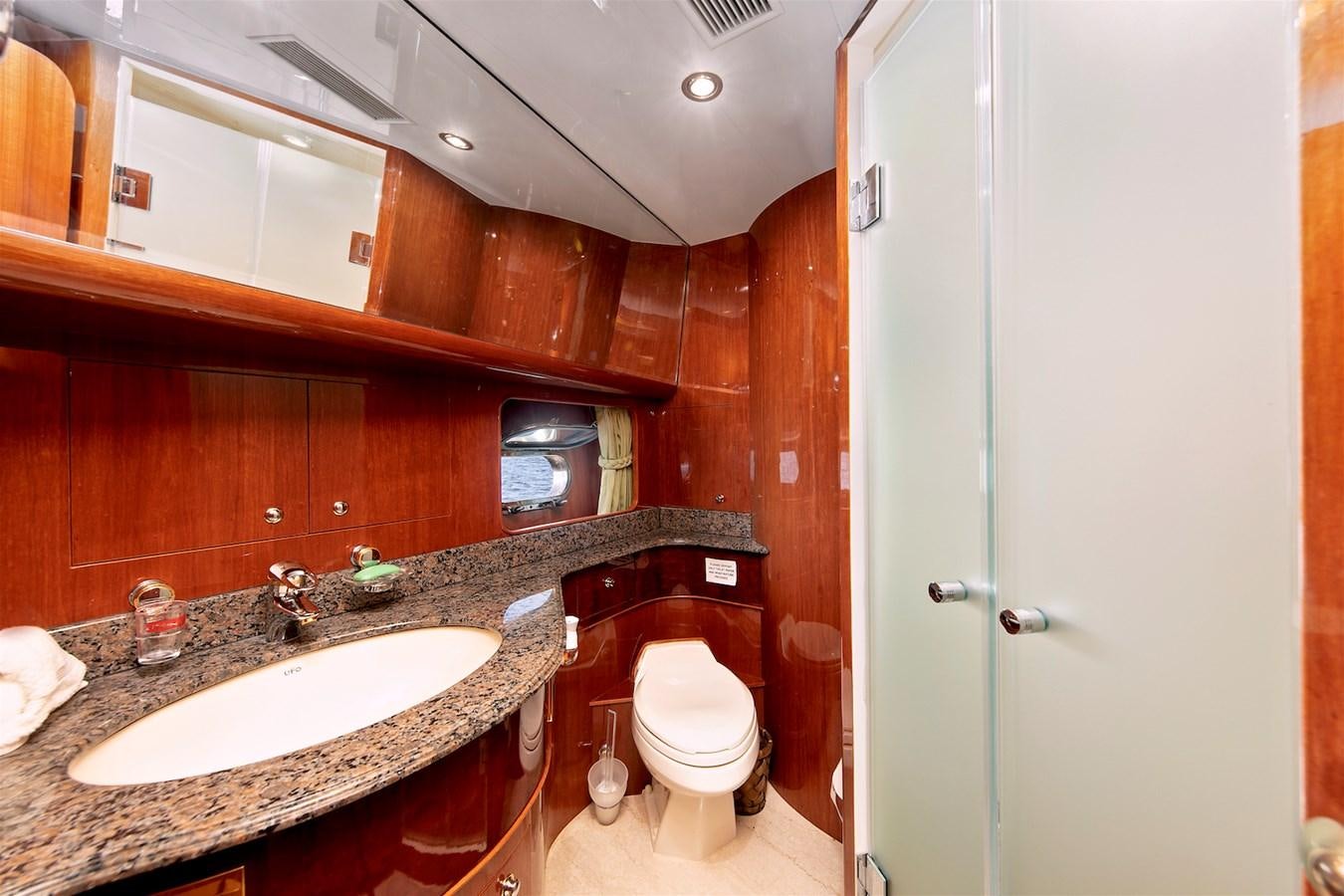 a bathroom with a sink and toilet aboard PAPA'S PLACE Yacht for Sale