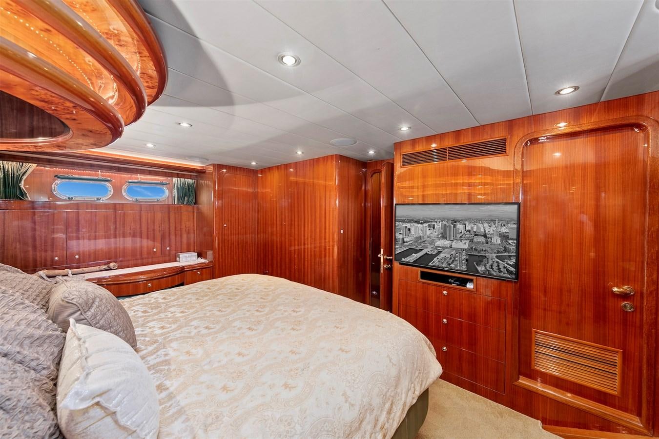 a room with a bed and a cupboard aboard PAPA'S PLACE Yacht for Sale