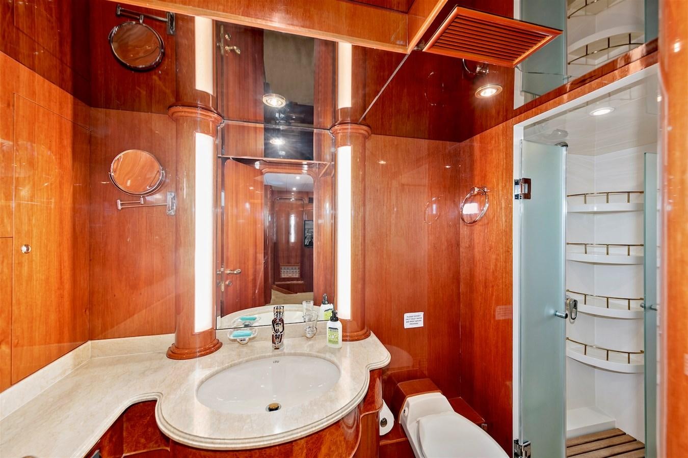 a bathroom with a sink and a shower aboard PAPA'S PLACE Yacht for Sale
