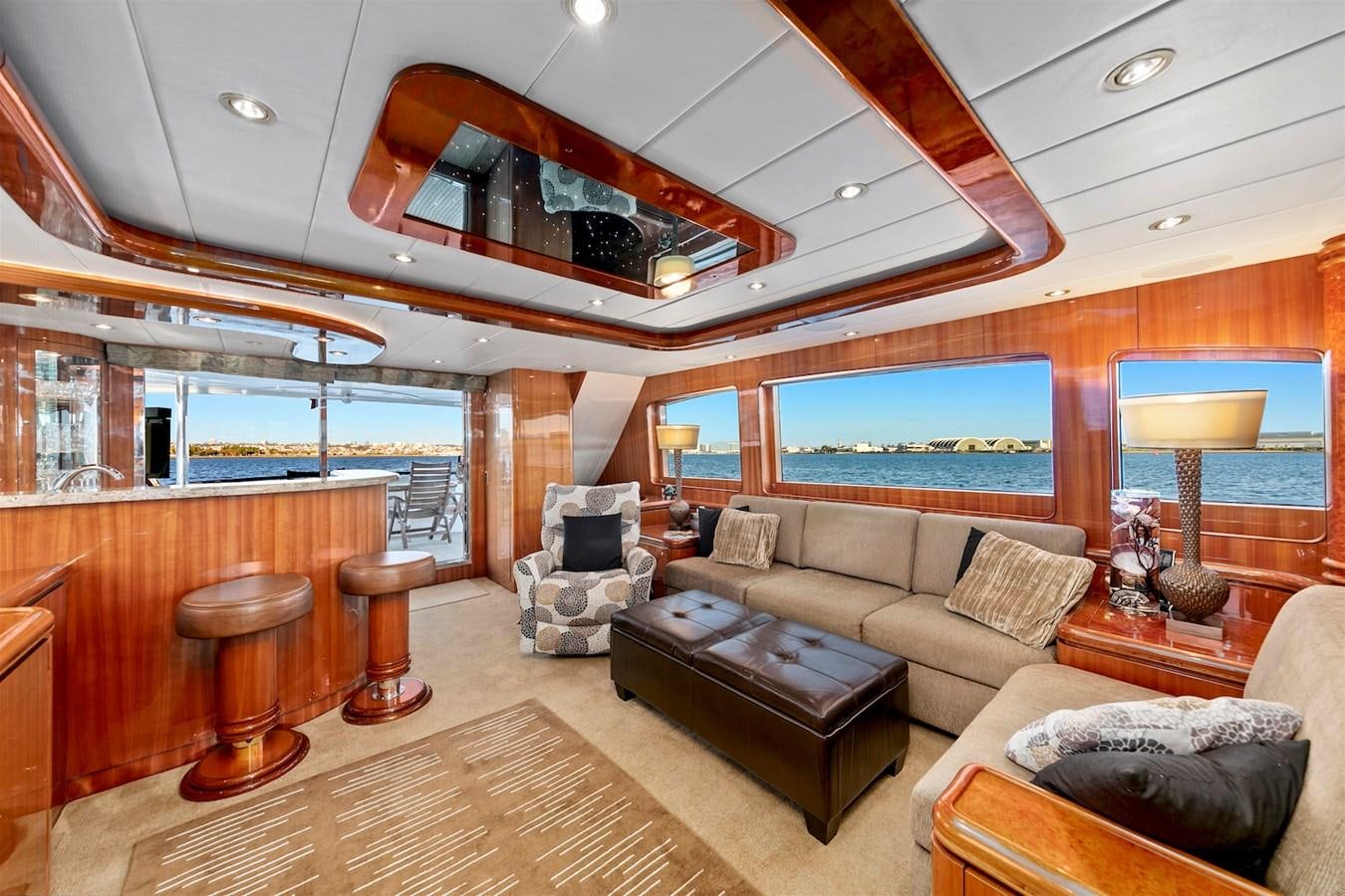 a living room with a large chandelier aboard PAPA'S PLACE Yacht for Sale