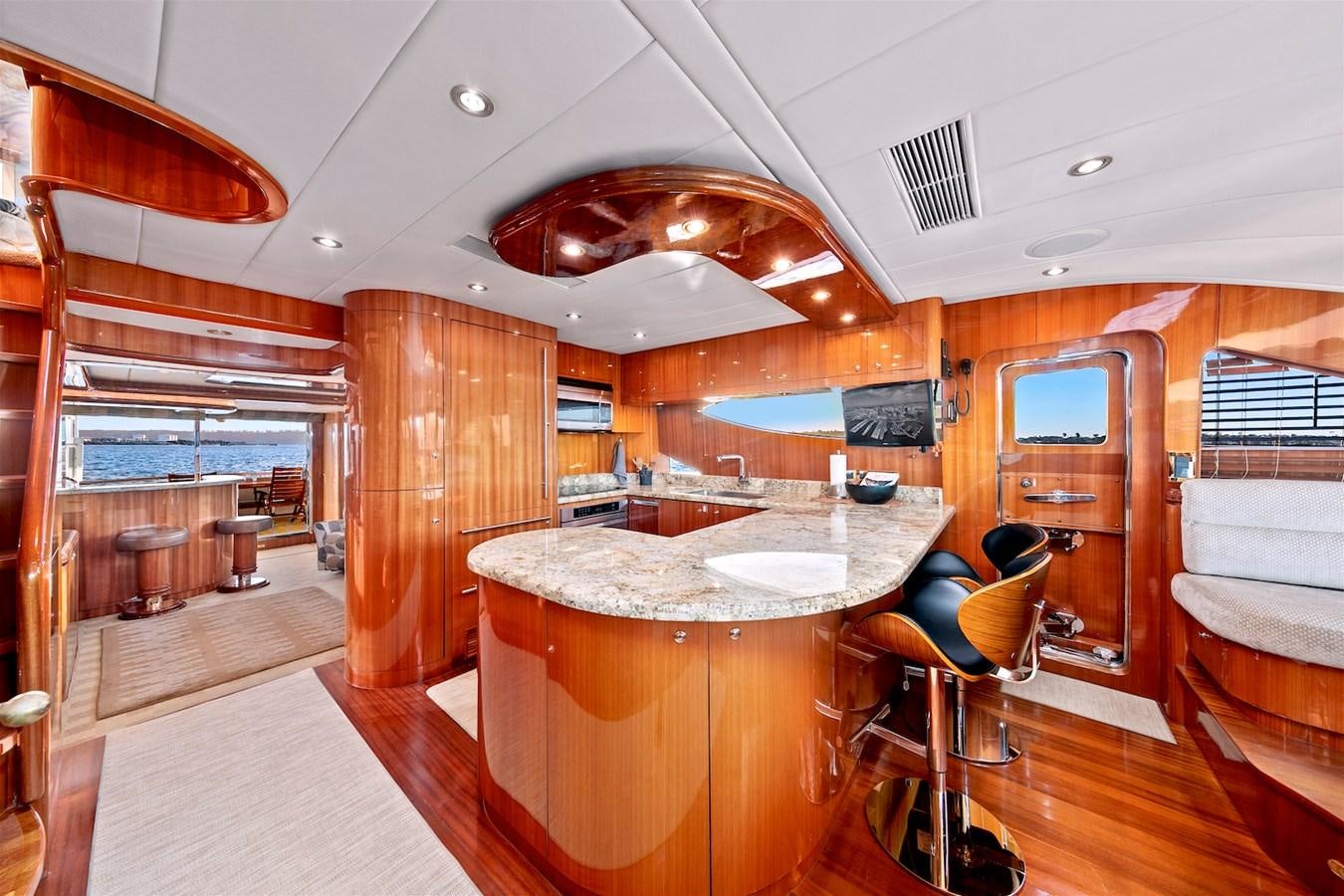 a large kitchen with a table aboard PAPA'S PLACE Yacht for Sale
