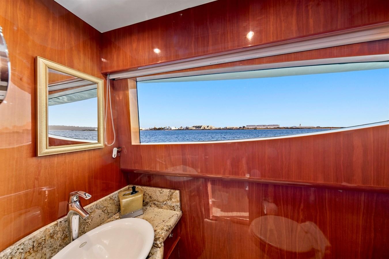 a bathroom with a large window aboard PAPA'S PLACE Yacht for Sale