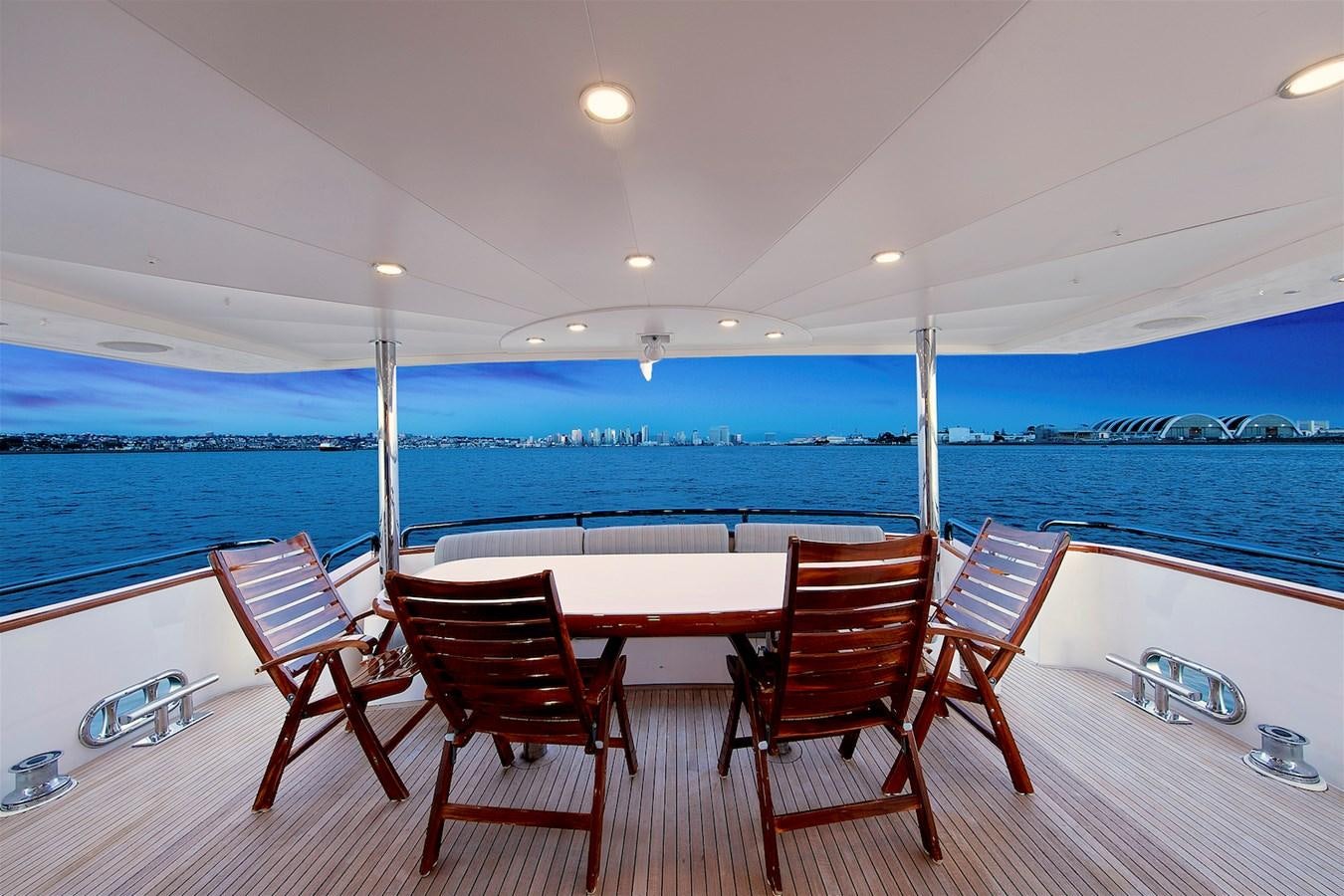 a table and chairs on a deck aboard PAPA'S PLACE Yacht for Sale