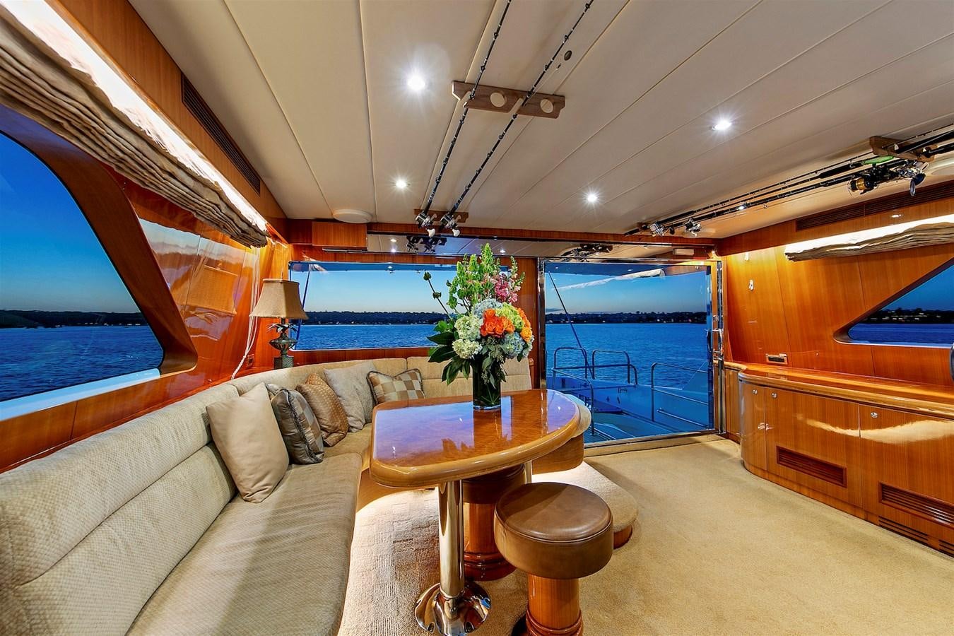 a living room with a couch and a table aboard PAPA'S PLACE Yacht for Sale