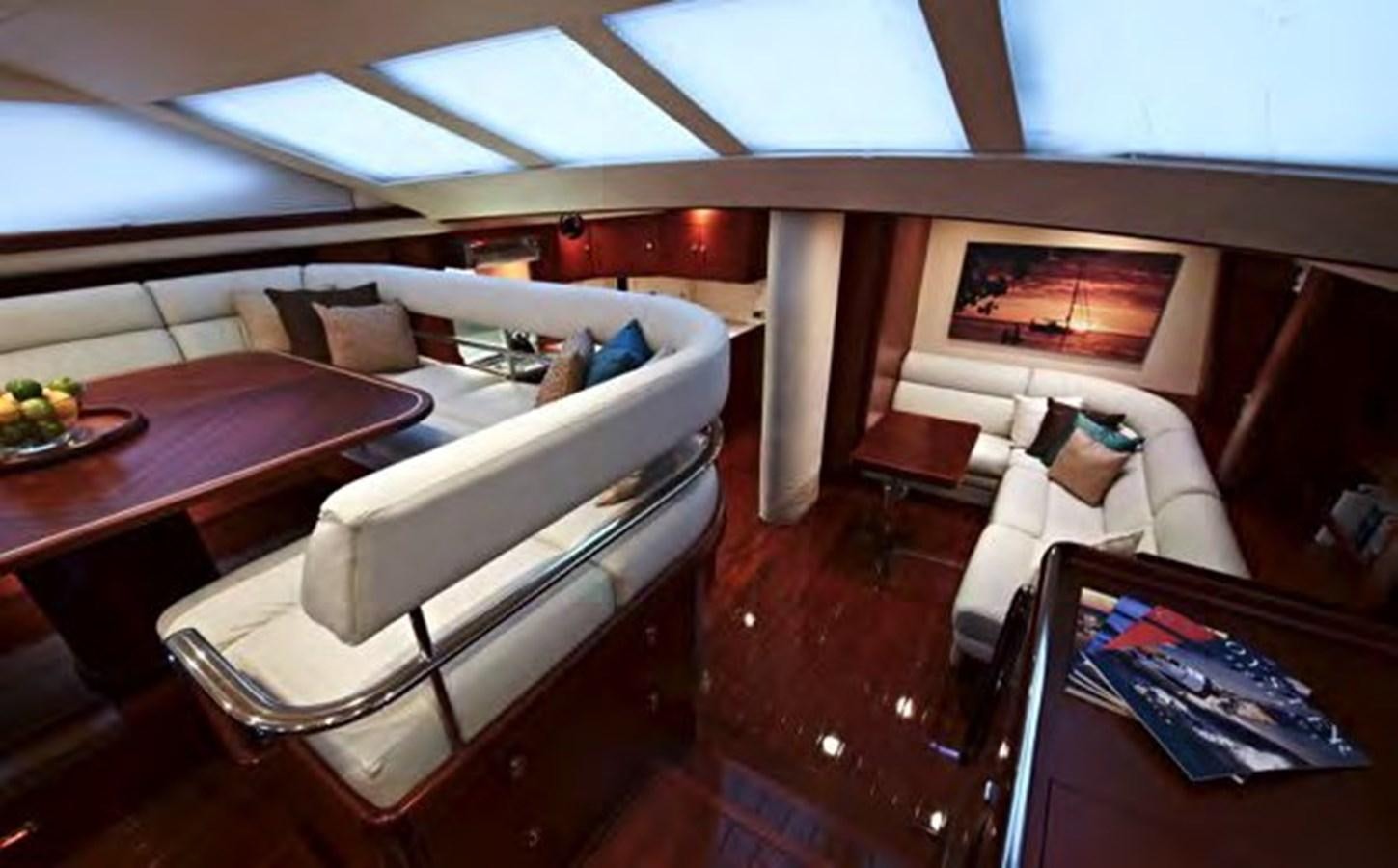 a room with a couch and a table aboard TILLYMINT Yacht for Sale