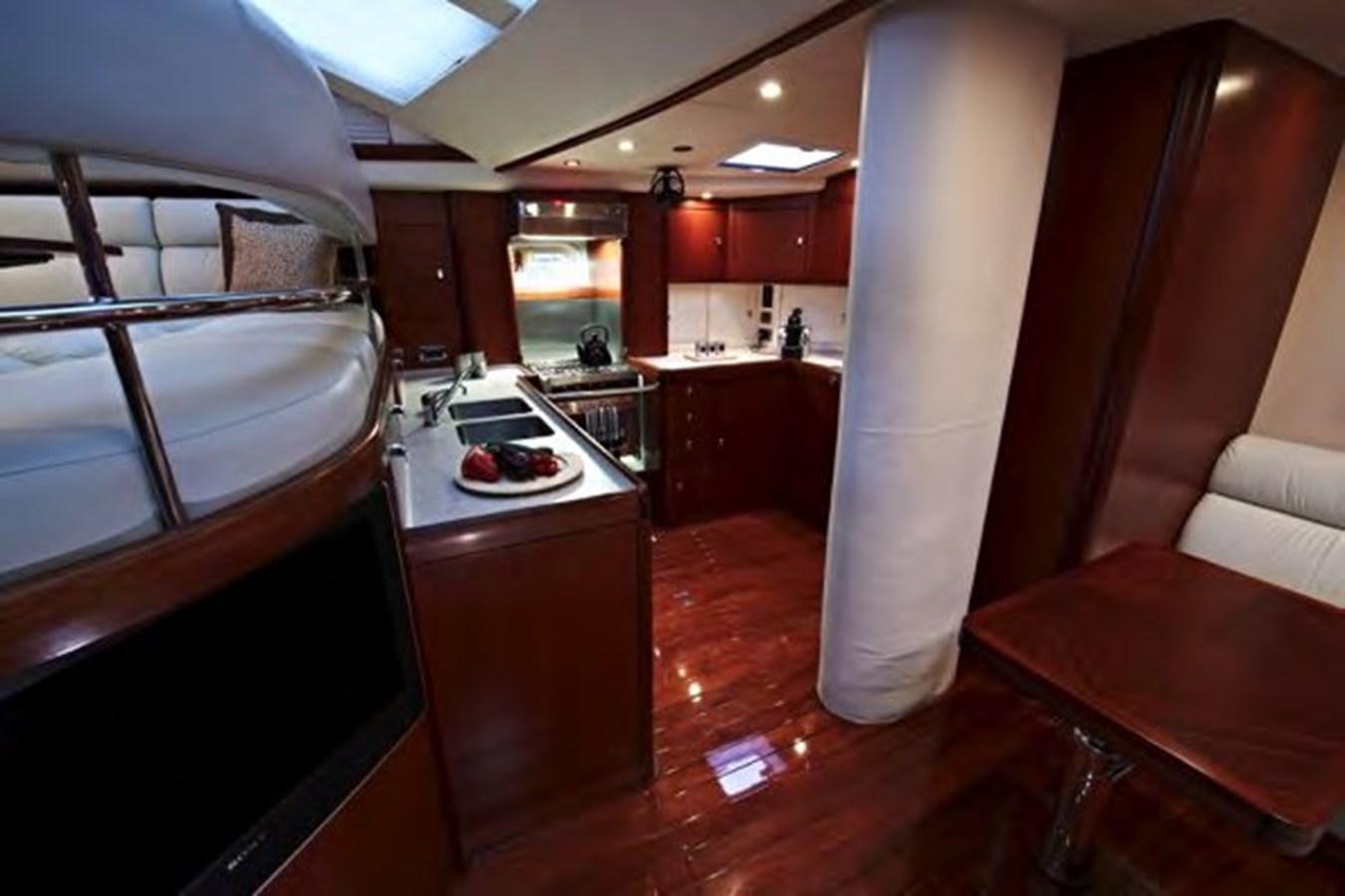 a kitchen with a red counter and a white column aboard TILLYMINT Yacht for Sale