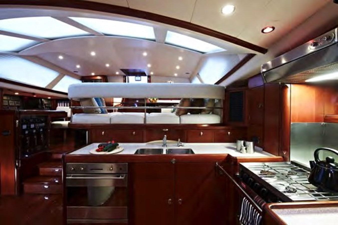 a kitchen with a large island aboard TILLYMINT Yacht for Sale