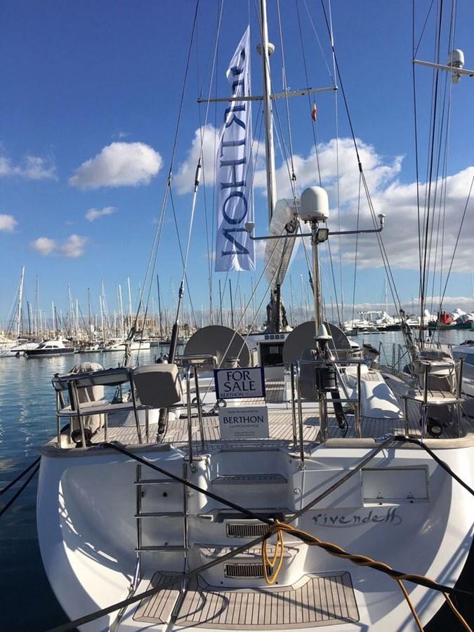 a boat docked at a pier aboard BILL AND ME Yacht for Sale