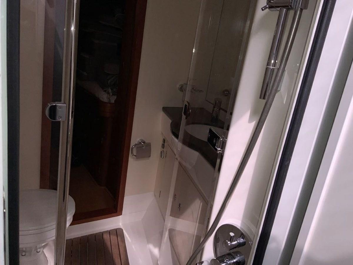 a bathroom with a tub sink and toilet aboard BILL AND ME Yacht for Sale