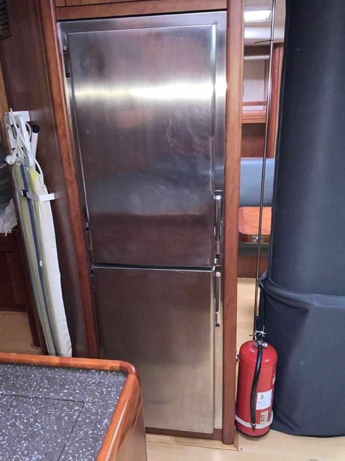 a black door with a red handle aboard BILL AND ME Yacht for Sale