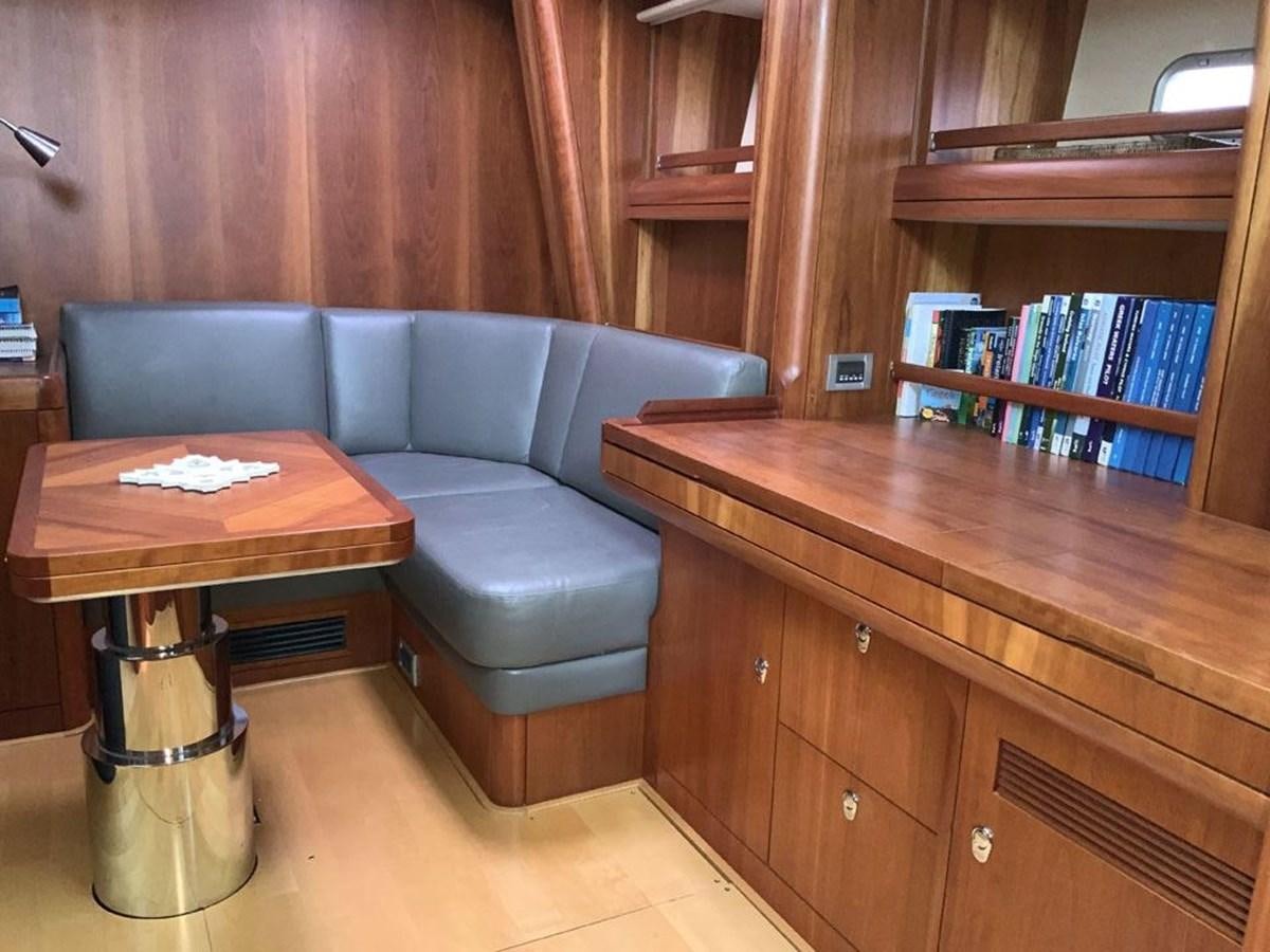 a living room with a couch and a table aboard BILL AND ME Yacht for Sale