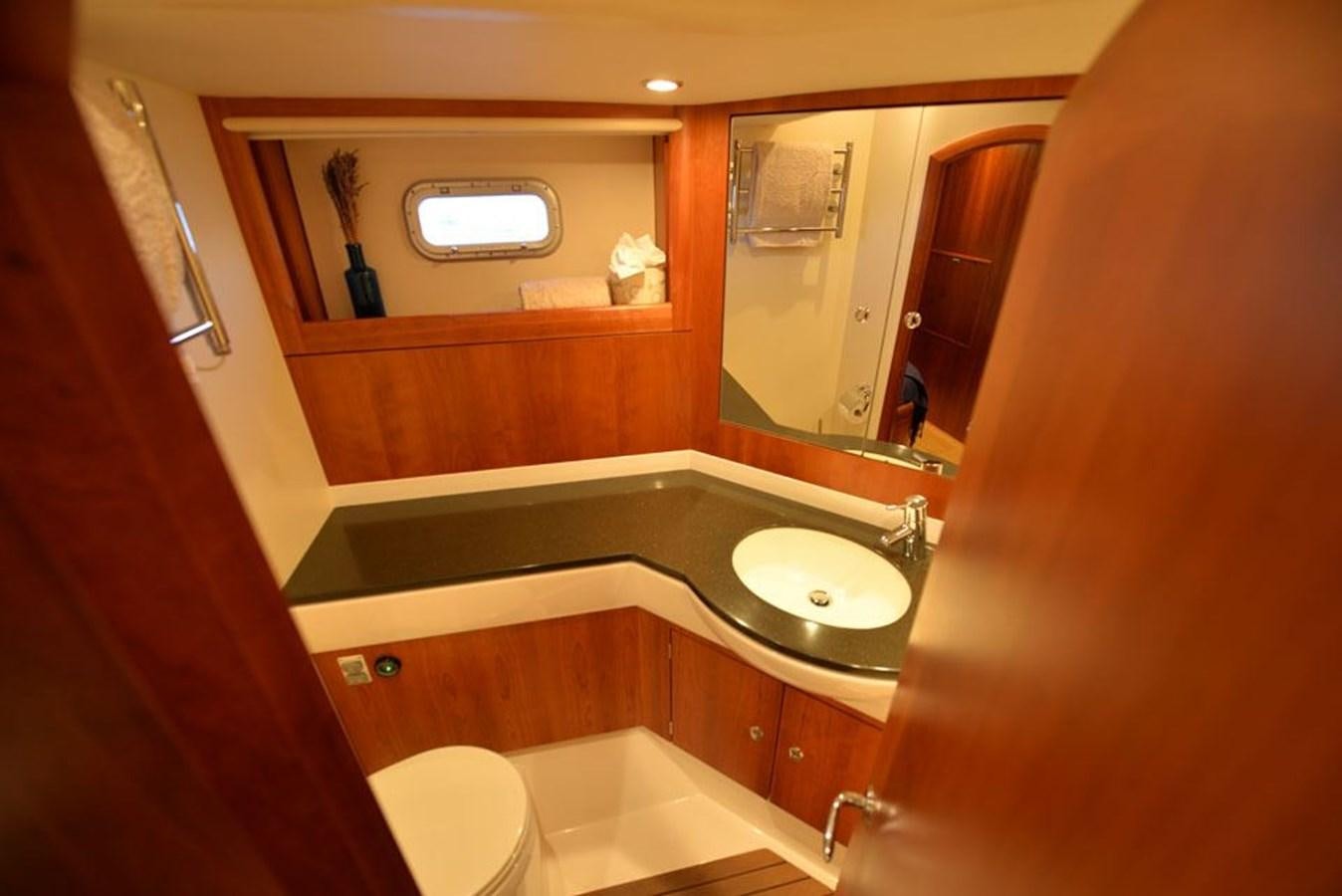a bathroom with a sink and a bathtub aboard BILL AND ME Yacht for Sale