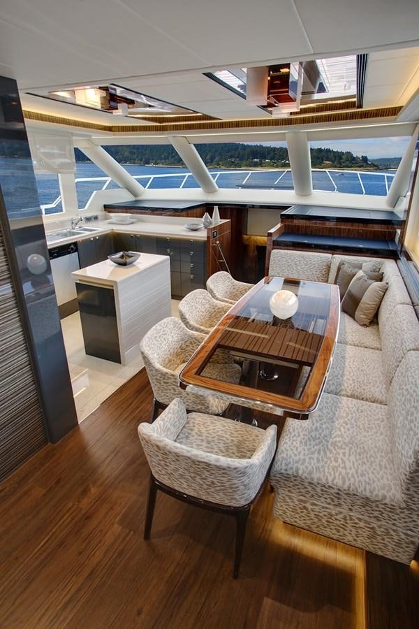 a room with a table and chairs aboard  V80 (NEW BOAT SPEC)  Yacht for Sale