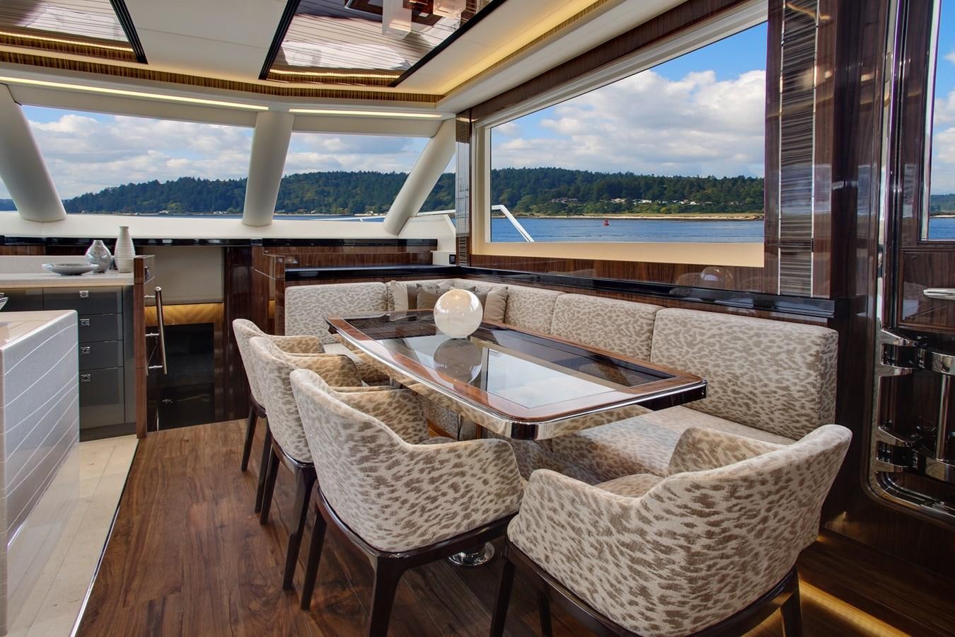 a room with a table and chairs aboard  V80 (NEW BOAT SPEC)  Yacht for Sale