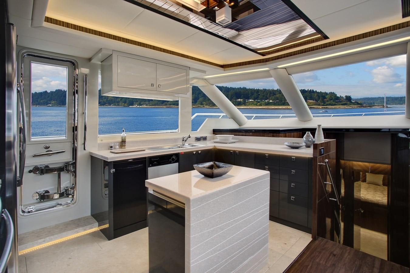 a room with a desk and a window aboard  V80 (NEW BOAT SPEC)  Yacht for Sale