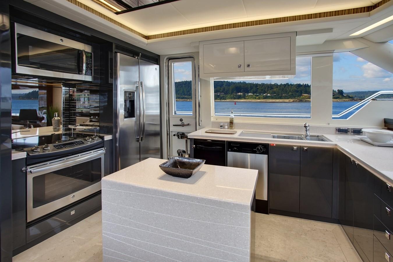 a kitchen with a large window aboard  V80 (NEW BOAT SPEC)  Yacht for Sale