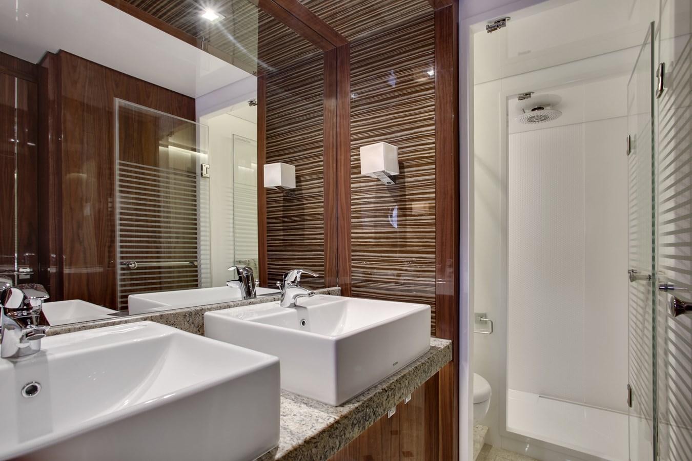 a bathroom with a sink and a mirror aboard  V80 (NEW BOAT SPEC)  Yacht for Sale