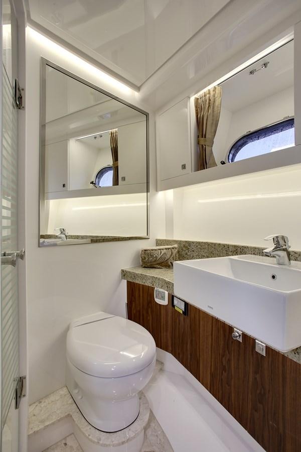 a bathroom with a toilet and a sink aboard  V80 (NEW BOAT SPEC)  Yacht for Sale