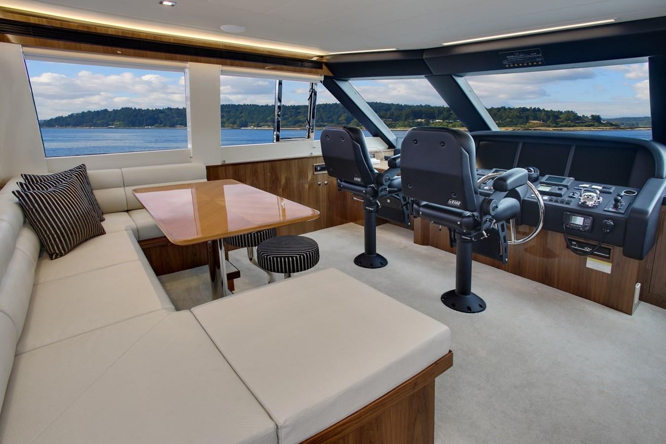a room with a table and chairs aboard  V80 (NEW BOAT SPEC)  Yacht for Sale