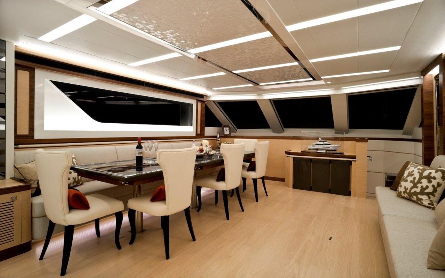 a room with a table and chairs aboard  V80 (NEW BOAT SPEC)  Yacht for Sale