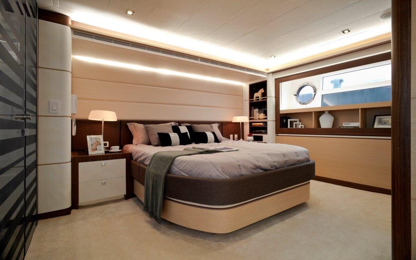 a bedroom with a bed and a desk aboard  V80 (NEW BOAT SPEC)  Yacht for Sale