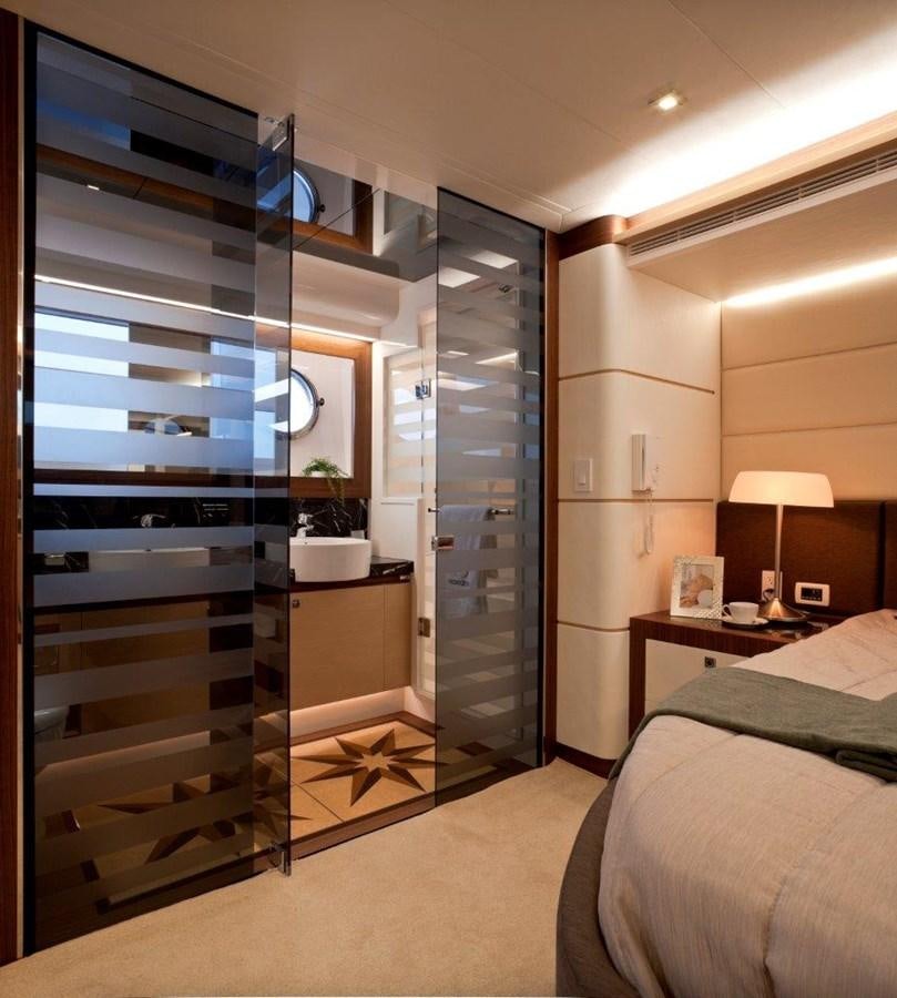 a modern bedroom with a glass wall aboard  V80 (NEW BOAT SPEC)  Yacht for Sale