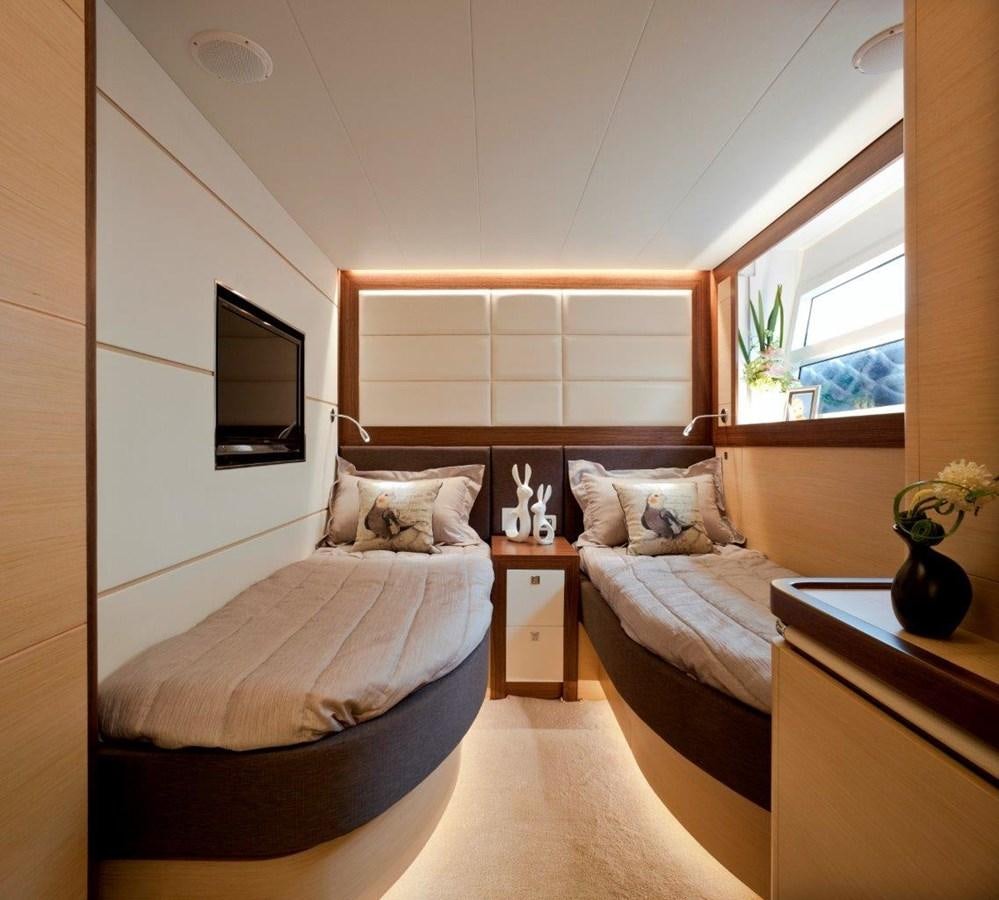 a bedroom with a bed and a television aboard  V80 (NEW BOAT SPEC)  Yacht for Sale