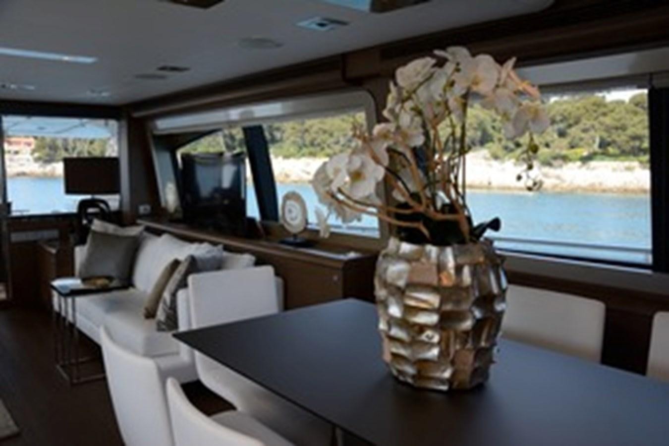 a vase with flowers in it aboard COLUMBUS A Yacht for Sale