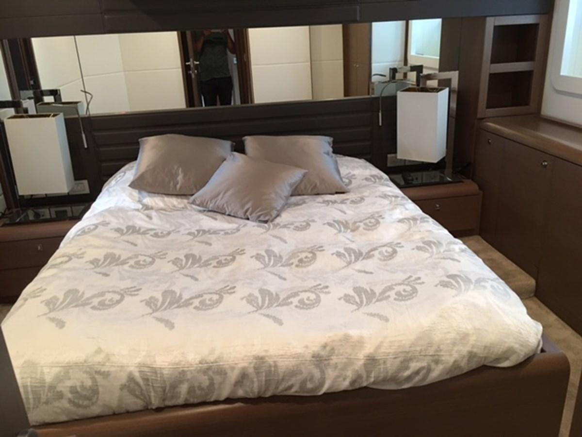 a bed with white sheets aboard COLUMBUS A Yacht for Sale
