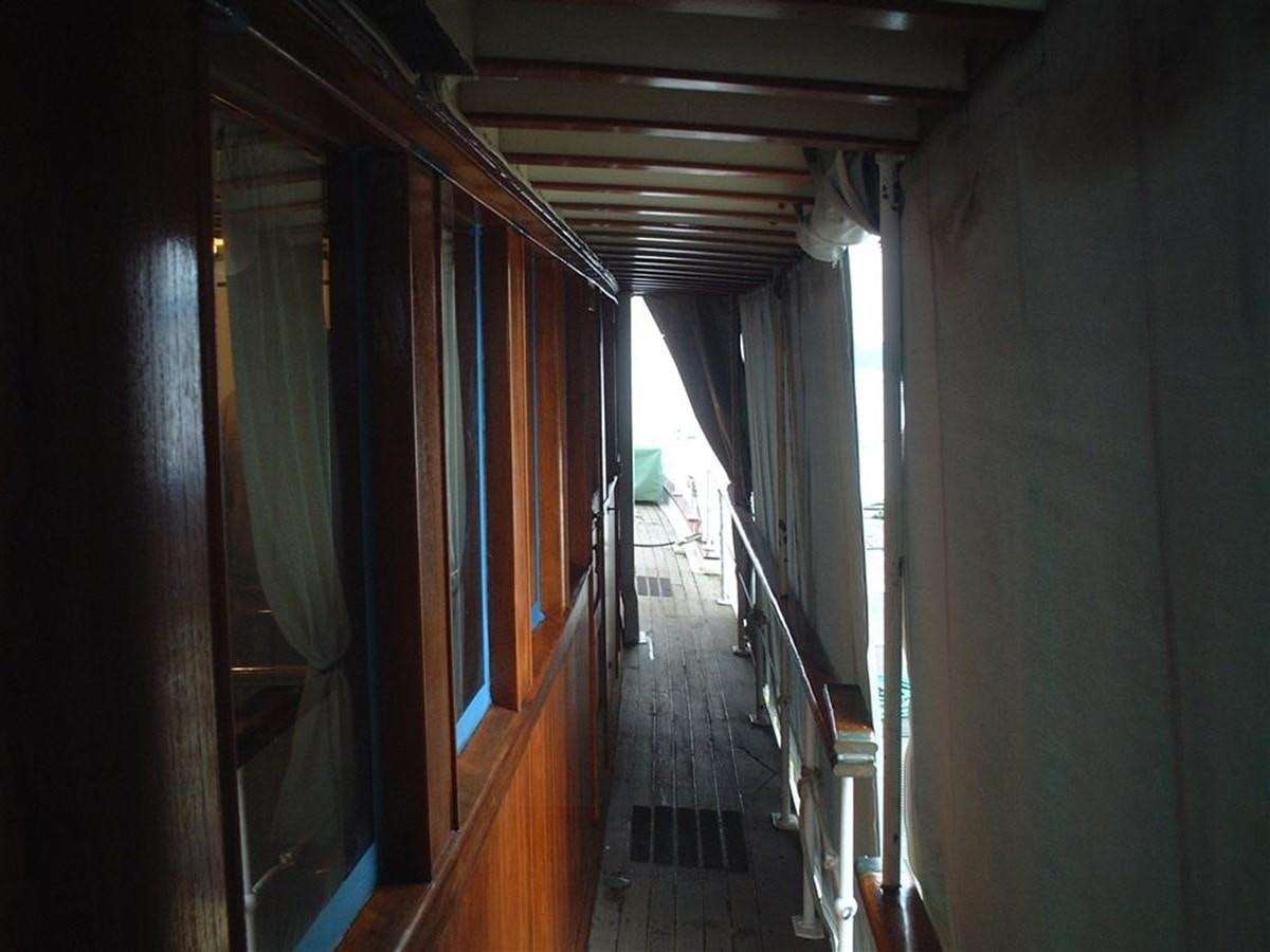 a hallway with blue and orange curtains aboard SYRENE I Yacht for Sale