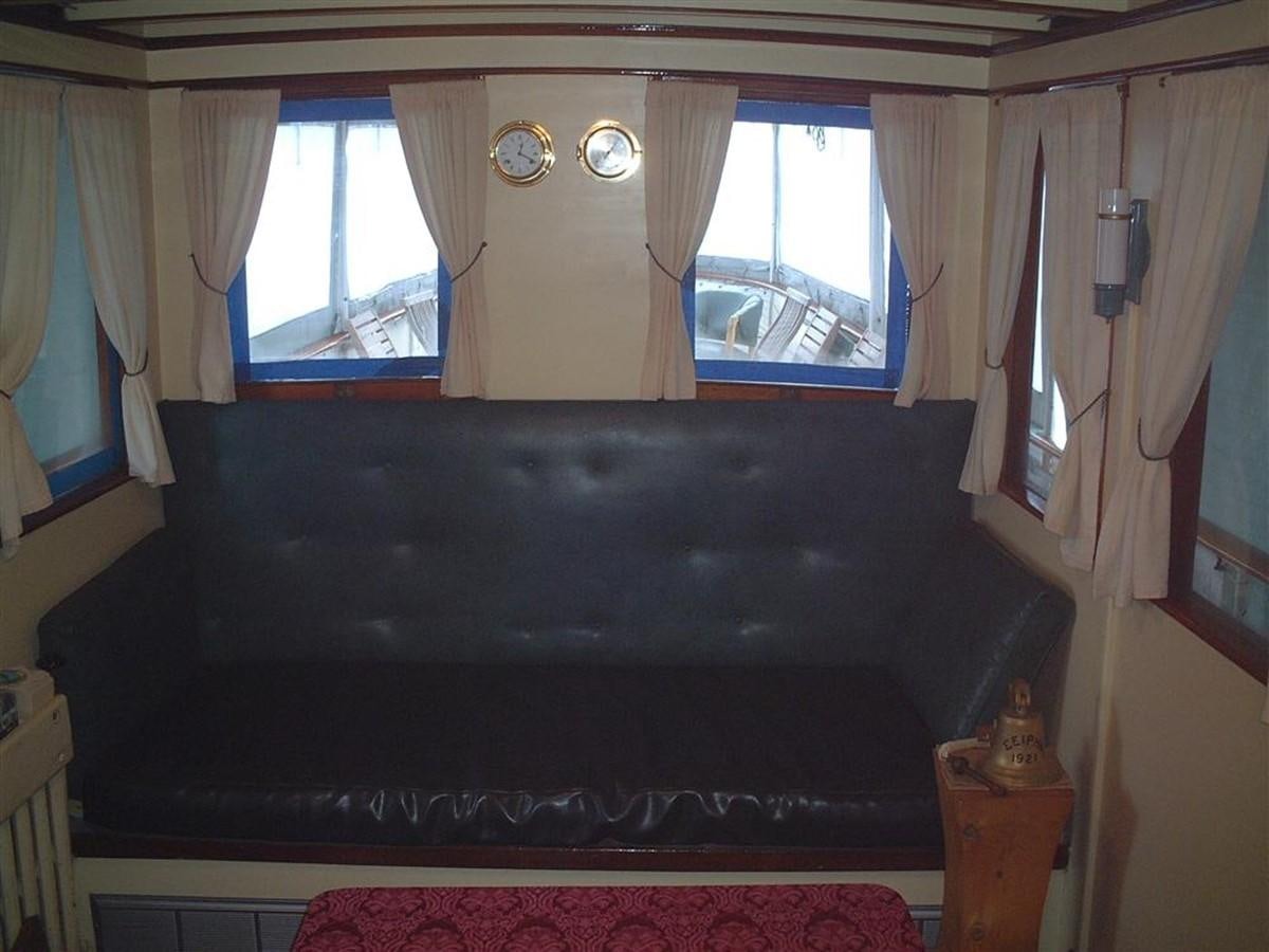 a bed with a black cover aboard SYRENE I Yacht for Sale