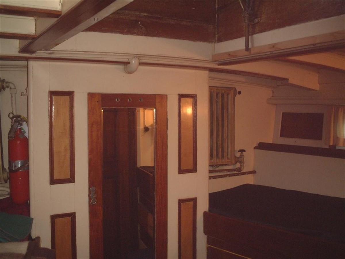 a room with a bed and a couch aboard SYRENE I Yacht for Sale