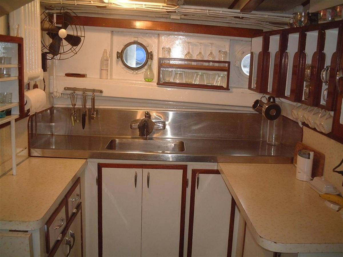 a kitchen with a large countertop aboard SYRENE I Yacht for Sale